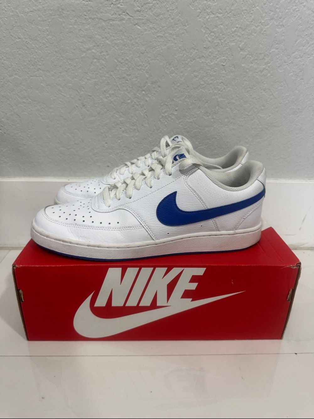 Nike White Low-Top Sneakers with Blue Swoosh